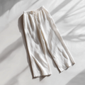 White pants on a light gray background