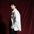 man  wearing a white jacket against a red curtain / ishq e amore linen jackets men 