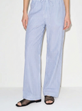 Person wearing blue and white striped pants on a white background ishq e amore